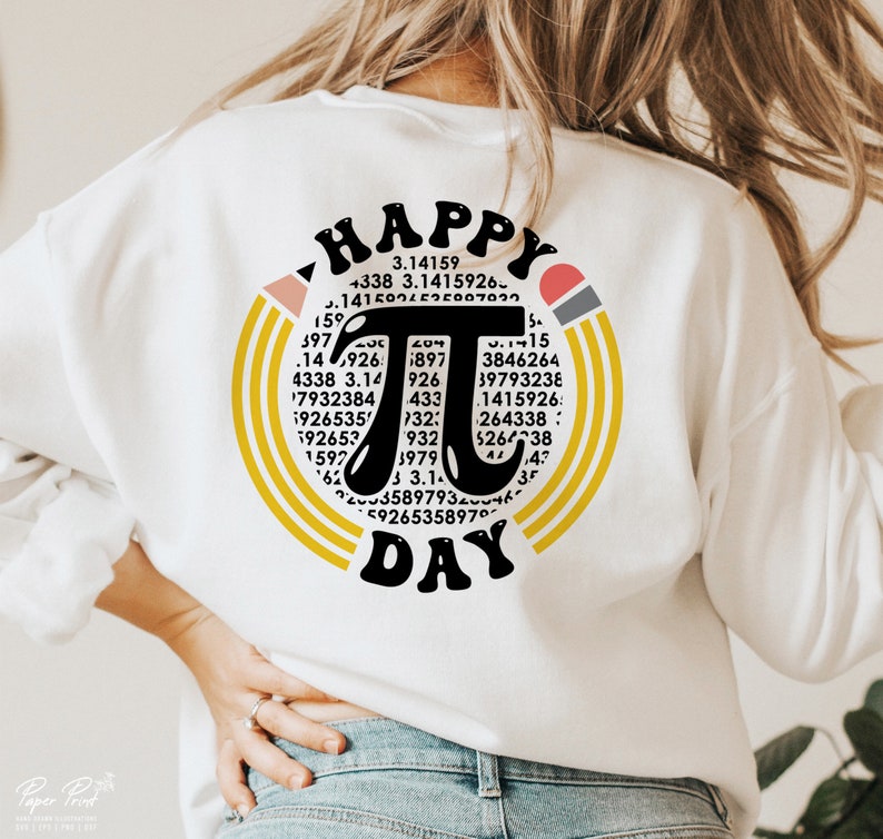 May include: White sweatshirt with a black and yellow graphic design that says "Happy Pi Day". The graphic features a large pi symbol surrounded by numbers.