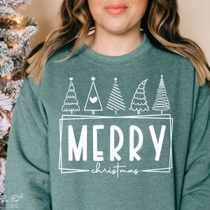 May include: A teal green sweatshirt with a white design of five stylized Christmas trees and the text "Merry Christmas" in a white box.