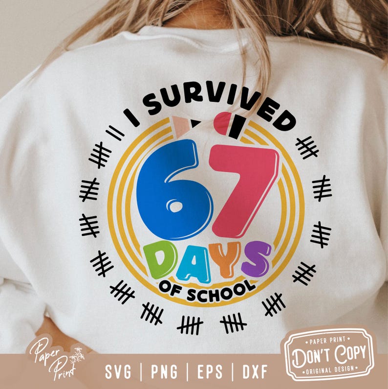 May include: White sweatshirt with a colorful graphic that reads "I Survived 67 Days of School." The design includes a pencil, tally marks, and the words "Days of School" in a rainbow color scheme. The sweatshirt also has the text "Paper Print" and "Don't Copy".