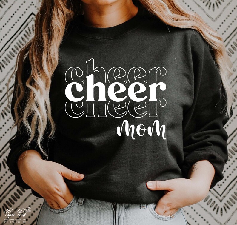 May include: Black sweatshirt with white text that reads "cheer cheer cheer mom".
