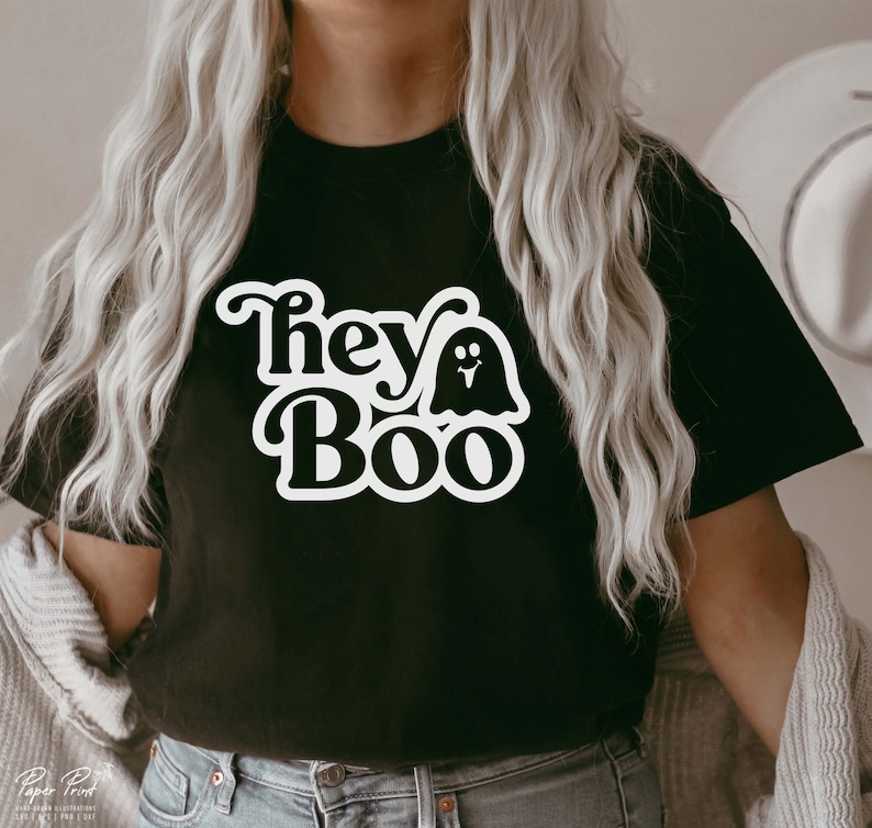 May include: Black t-shirt with a white graphic that says "Hey Boo" with a ghost illustration.