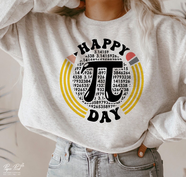 May include: A gray sweatshirt with a graphic design of a yellow and orange circle with the word "HAPPY" at the top and the word "DAY" at the bottom. Inside the circle is a large black pi symbol with numbers surrounding it.