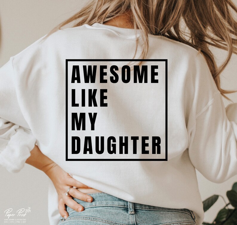 May include: White sweatshirt with black text that reads "Awesome Like My Daughter" in a square frame.