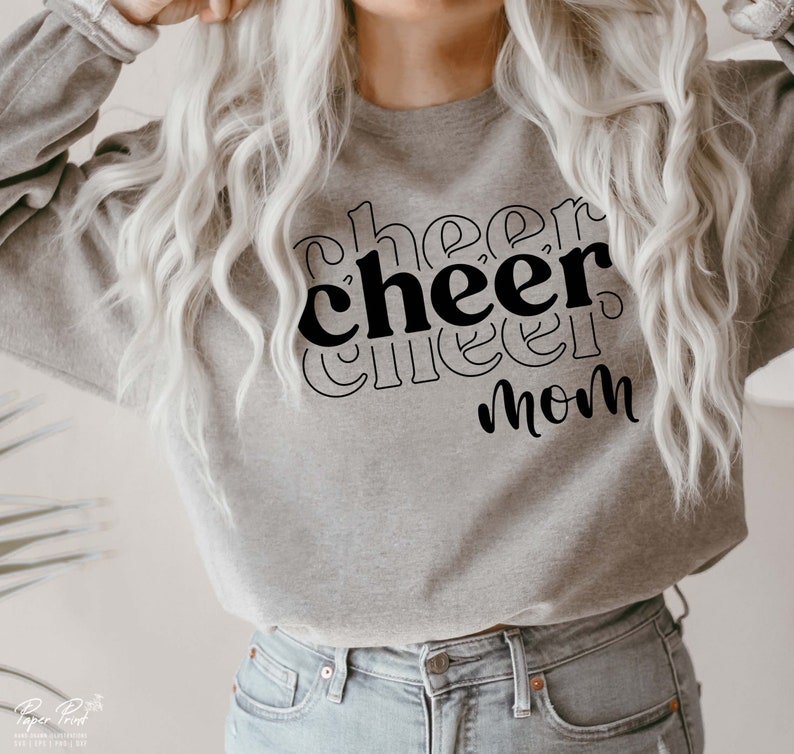 May include: A grey sweatshirt with the text "cheer cheer mom" printed in black.