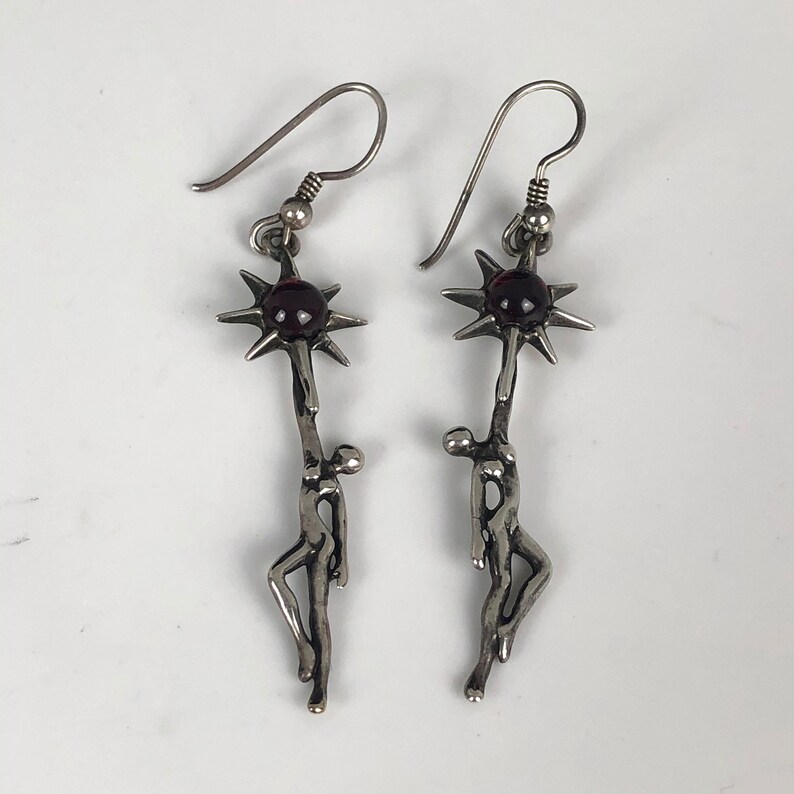 Rare Sterling Silver Female Silhouette Holding or Reaching a Purple Garnet SunStar
