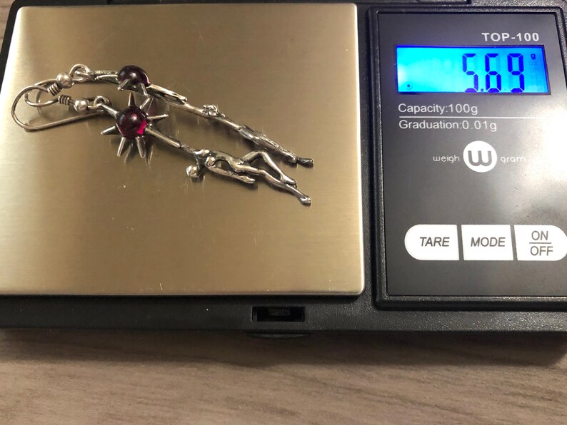Rare Sterling Silver Female Silhouette Holding or Reaching a Purple Garnet SunStar