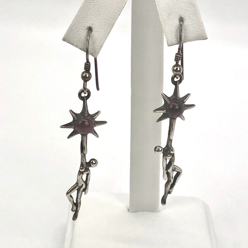 Rare Sterling Silver Female Silhouette Holding or Reaching a Purple Garnet SunStar