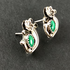 May include: Sterling silver earrings with green malachite stones and floral designs.