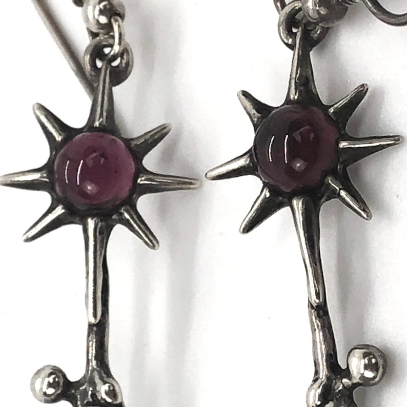 Rare Sterling Silver Female Silhouette Holding or Reaching a Purple Garnet SunStar