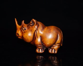 La antigua estatua natural de rinoceronte de madera de caja, antigua artesanía pura talla hecha a mano, rara y exquisita