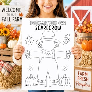 May include: A white coloring page featuring a black line drawing of a scarecrow wearing a hat and overalls, with the text DECORATE YOUR OWN SCARECROW at the top. The page includes illustrations of autumn leaves and two pumpkins at the bottom.