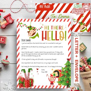 May include: A Christmas elf arrival letter and matching envelope set featuring red and white diagonal stripes, green elf illustrations, and text addressed to Emma. The letter includes a North Pole message and the envelope is marked Elf Mail.