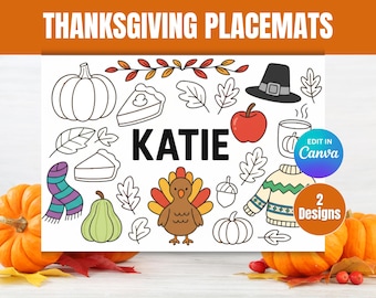 May include: Thanksgiving placemats with a festive design. The placemat features hand-drawn illustrations of pumpkins, pie, leaves, a turkey, and a pilgrim hat. The name "KATIE" is displayed in bold letters. The image also includes the text "Edit in Canva" and "2 Designs".