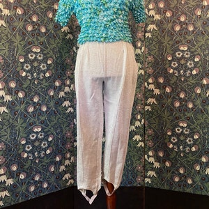 Lurex stirrup pants in silver, disco style