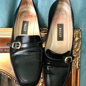 Vintage Bally leather heeled loafers in black with buckle detail, size 5