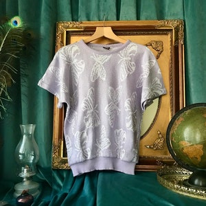 Short sleeves jumper in pale purple with white butterflies, size M