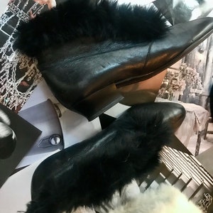 Leather ankle boots with faux fur trim in black, size 6