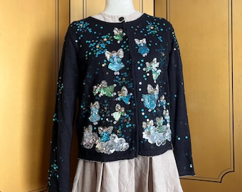Zwart katoenen vest met blauwe feestelijke pailletten, maat S, M, L