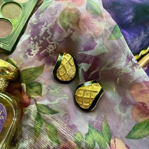 Vintage gold clip on earrings with black enamel detail