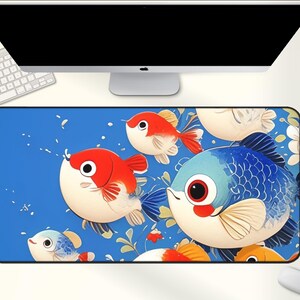 May include: A rectangular mouse pad featuring a vibrant illustration of cartoon fish in shades of red, blue, and white against a blue background. The design includes various fish and floral elements, creating a playful and colorful aesthetic.