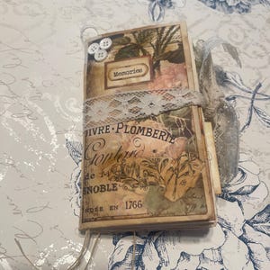 May include: A set of three ceramic mugs with a speckled, matte finish. The mugs are in shades of cream, light gray, and dark gray. Each mug has a simple, minimalist design and a rounded handle.