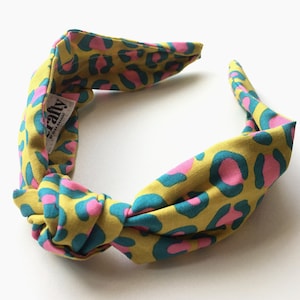Colourful animal print front knot headband | Knot alice twisted hairband | Bold jungle print hair accessory | Leopard print twisted headband