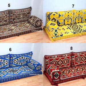 May include: Four different styles of floor cushions with geometric patterns. The cushions are brown, yellow, blue, and red. Each cushion has two large back cushions and two smaller cushions. The cushions are arranged in two rows of two.