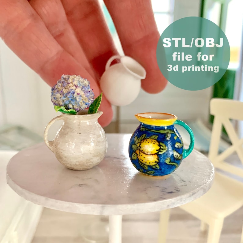 May include: Two miniature ceramic jugs, one white and one blue with yellow lemons, on a white marble table.  STL/OBJ file for 3d printing.
