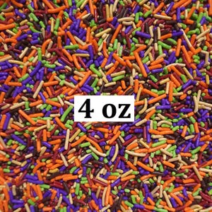 Puede incluir: Primer plano de chispas de colores en naranja, morado, verde, marrón y beige. La imagen incluye el texto "4 oz" en un rectángulo blanco. Estas chispas son perfectas para decorar productos horneados.