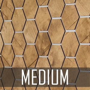 May include: A wall covered in brown hexagonal tiles with black and white borders. The word "MEDIUM" is printed in white on a brown rectangle at the bottom of the image.