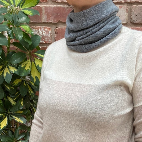 Grey merino wool, neck warmer, neck gaiter, snood. Lightweight but warm. Great for cyclists, skiing, gardening, walking and travelling.