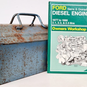 May include: A blue metal toolbox with a rusty patina and a Haynes Owners Workshop Manual for a Ford Sierra and Granada Diesel Engine. The manual covers models from 1977 to 1990 with 2.1, 2.3, and 2.5 litre engines.