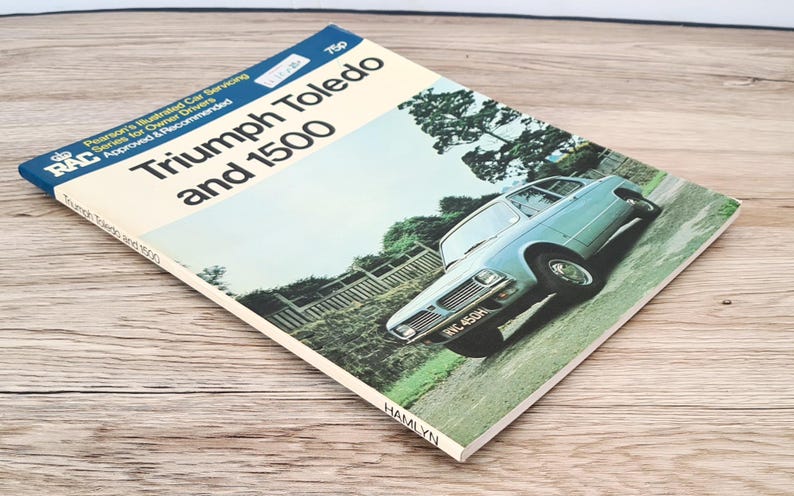 May include: A vintage RAC (Royal Automobile Club) repair manual for the Triumph Toledo and 1500 cars. The cover features a blue car with a white license plate that reads "RVC 450H".