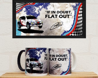 May include: A white Ford Focus rally car with the number 4 on the side, driving on a blue and red chequered background. The text "IF IN DOUBT, FLAT OUT" is written in black on the background.