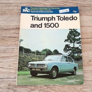 May include: A vintage book cover featuring a blue Triumph Toledo 1500 car. The cover is titled "Triumph Toledo and 1500" and includes the RAC logo and the price of 75p.
