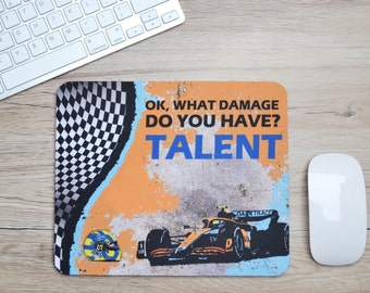 May include: A mouse pad with a checkered flag design, a race car, and the text "OK, WHAT DAMAGE DO YOU HAVE? TALENT".