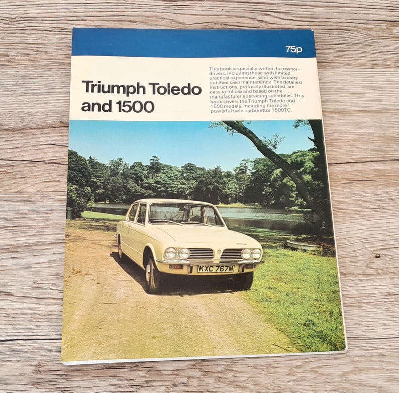 May include: A vintage book cover for a Triumph Toledo and 1500 car maintenance manual. The cover features a yellow car with a license plate that reads "KXC 767M" and a green background with a lake and trees.