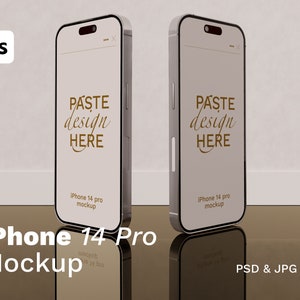 May include: A mockup of a silver iPhone 14 Pro with a white screen displaying the text "PASTE design HERE". The phone is on a reflective surface.