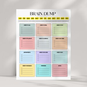 May include: A colorful Brain Dump planner with sections for tasks like calls, emails, and appointments. The planner features a monthly calendar at the top and task lists in various pastel colors. The title "BRAIN DUMP" is at the top.