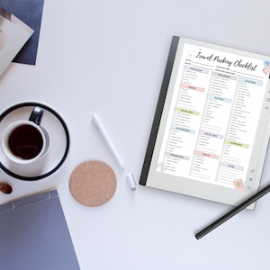 May include: A digital tablet with a white background and a checklist titled "Travel Packing Checklist" with categories for documents, electronics, toiletries, clothing, shoes, accessories, health and first aid, and other items. The checklist is on a white background with a black stylus next to it.