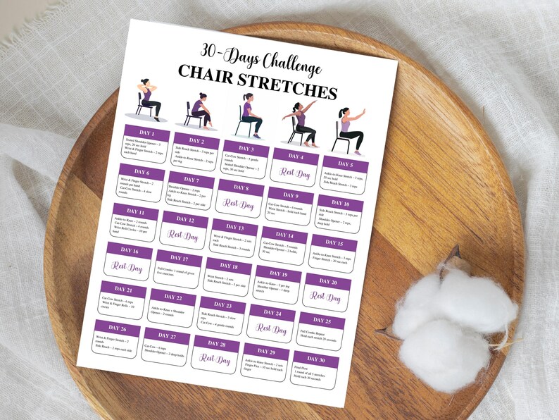 May include: A white printed sheet with a 30-Days Challenge Chair Stretches program. The sheet has a grid of purple boxes with exercise instructions and illustrations of people doing chair stretches. The sheet is on a wooden tray.