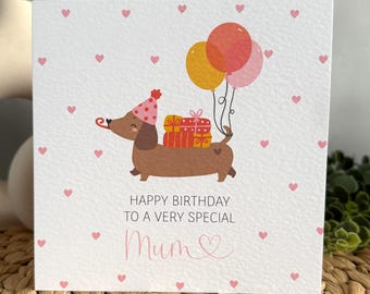 Personalised Dachshund Birthday Card: Sausage dog with balloons and presents