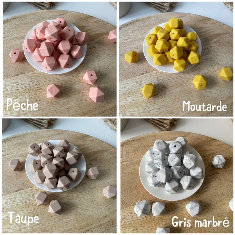May include: Four sets of silicone teething beads in different colors: peach, mustard yellow, taupe, and gray marble. Each set is displayed on a white plate on a wooden surface.