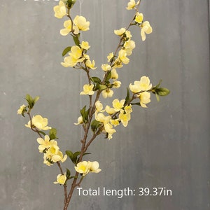 May include: A branch of yellow artificial flowers with green leaves. The branch is about 39.37 inches long. The text "Yellow" is at the top of the image.
