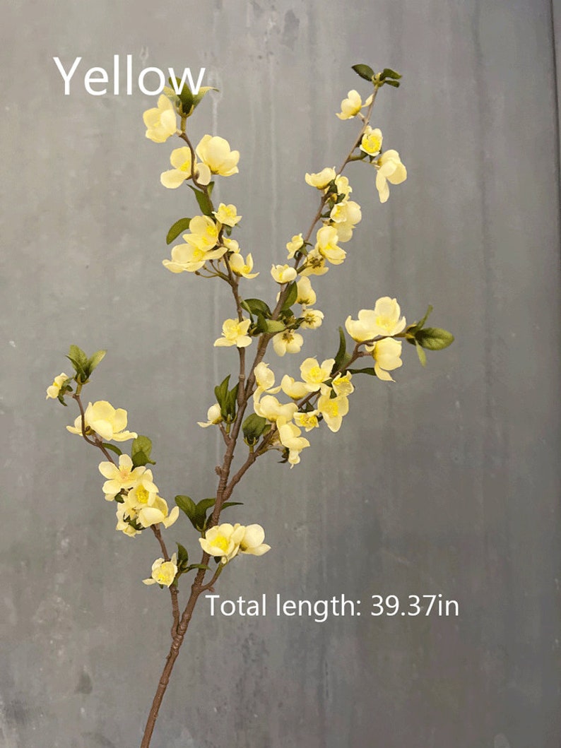 May include: A branch of yellow artificial flowers with green leaves. The branch is about 39.37 inches long. The text "Yellow" is at the top of the image.