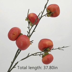 May include: A branch with six red artificial persimmons, with green leaves, and a total length of 37.80 inches. The text "Red" is at the top of the image.