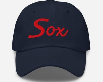 May include: A navy blue baseball cap with a red embroidered "Sox" logo.