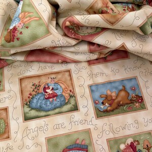 May include: A cream-colored fabric featuring a repeating pattern of rectangular illustrations depicting angels and dogs. The text "Angels are friends following you" is printed in a cursive font between the images, surrounded by dotted lines.