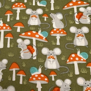 May include: A fabric pattern featuring a repeating design of light gray mice and orange mushrooms with white spots on an olive green background. Some mice carry orange backpacks, while small blue snails rest atop the mushroom caps.