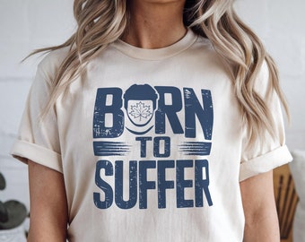 苦しみのために生まれたTシャツ：リーフス・ホッケーファンのユニセックスTシャツ